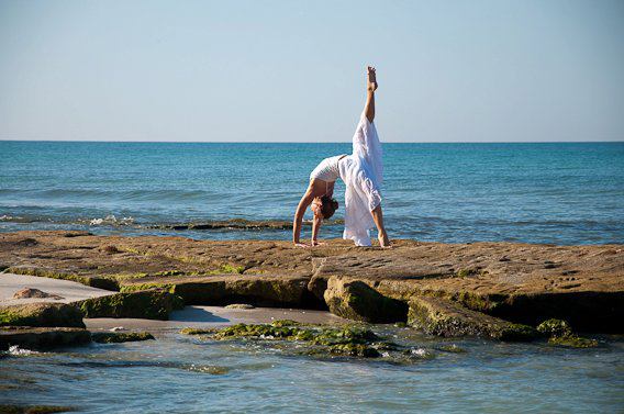 Emily Seymour yoga pose backbend on the beach